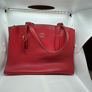 Coach Charlie Jasper Red Pebble Leather Carryall with crossbody strap.